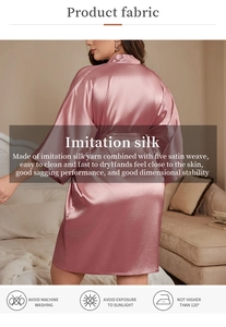 Detail of silk satin robe in dusty rose featuring smooth texture and premium draped fabric