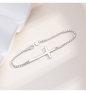Detailed view of S925 sterling silver cross bracelet with box chain and lobster clasp