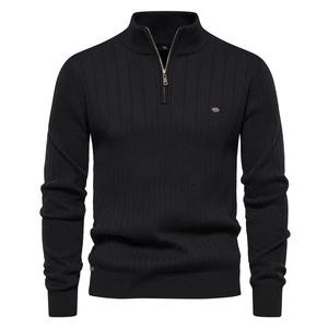 Close-up of black men's half-zip knit sweater showing ribbed texture and collar detail