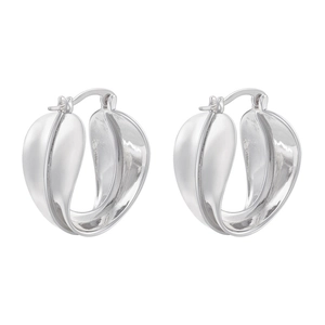 Macro shot of silver U-shaped hoop earrings with chunky leaf texture and polished finish