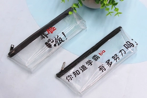 Transparent PVC pencil cases with black zippers and Chinese motivational text on desk