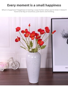 Vibrant red silk poppies in a minimalist grey ink-wash ceramic vase for home decor