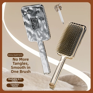 Detail of liquid metal texture hairbrushes with protective rounded bristles and cleaning tool