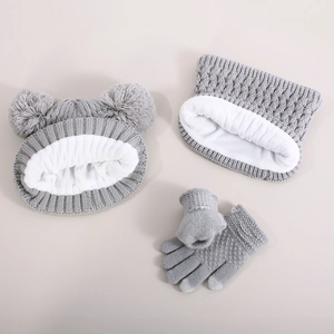 Detailed view of gray knit winter set for babies with thick fleece lining and double pom-poms