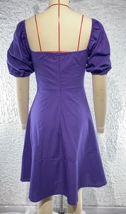 Detail view of purple puff sleeve dress with a back zipper closure and midi length