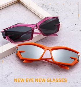 Futuristic geometric sunglasses in purple and orange with sharp avant-garde cut-out frames