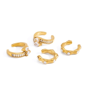 Gold stainless steel ear cuffs set with baguette-cut zircons and wavy textures
