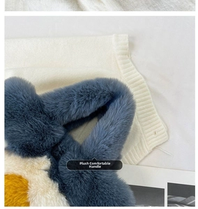 Close-up of tricolor plush tote bag showing soft blue, white and yellow faux fur details
