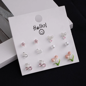 6-piece minimalist earring set featuring cherry, heart, tulip, and bow designs on card