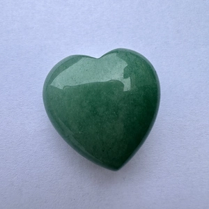 Polished 3cm natural green aventurine heart stone ornament on minimalist white paper