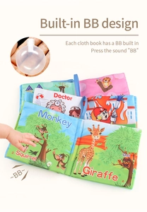 Detail of soft fabric baby book showing built-in squeaker and cute animal illustrations