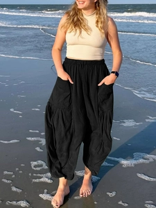 Detail of high-waist cotton linen wide-leg pants with elastic waist and large pockets