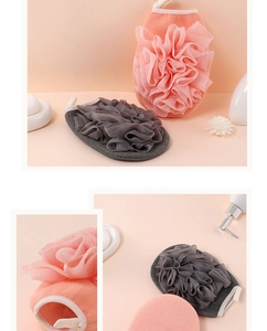 Detail of pink and grey dual-sided bath loofah and exfoliating scrub towel with hanging loop