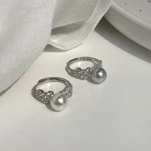 Elegant S925 silver rings with heart design, sparkling stones and white pearl accents