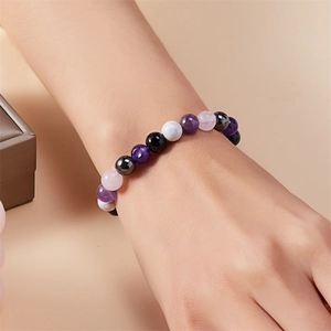 Close-up of 8mm natural stone beaded bracelet featuring multi-color gradient tones on wrist