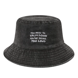Washed dark grey denim bucket hat with white embroidered calm down slogan for outdoor use