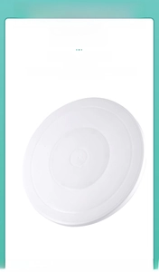 Close-up of smooth white cake turntable surface with non-slip rings for easy decorating