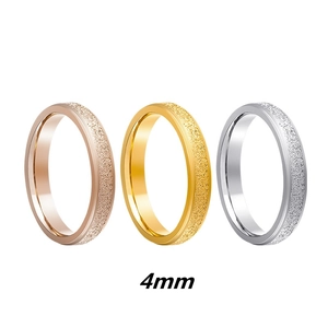 Detail showing 4mm matte finish stainless steel rings in rose gold, gold, and silver tones