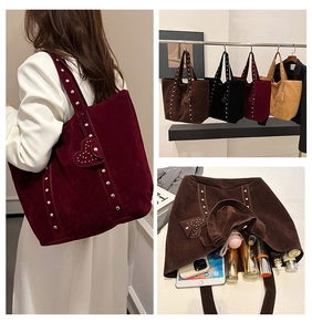 Detail view of large rivet tote bags in four colors with internal storage capacity view