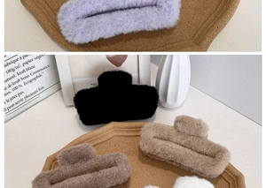 Detail view of large plush faux fur hair claw clips in five cozy autumn and winter colors