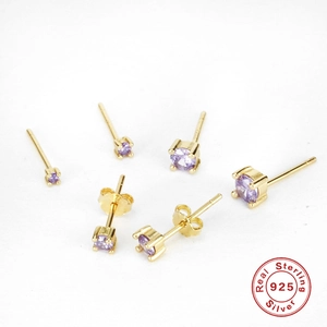 Set of three pairs of classic 925 silver gold-plated stud earrings with purple zircons