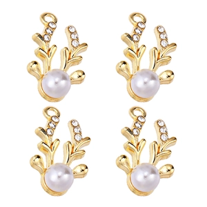 Detail of four golden deer antler pendants with inlaid rhinestones and large pearls
