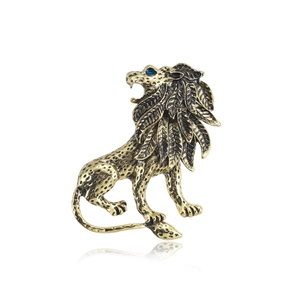 Vintage Baroque lion brooch in antique gold finish with detailed mane and blue gemstone eye