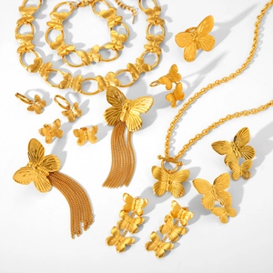 Golden butterfly jewelry set featuring necklace bracelet and tassel earrings in titanium steel