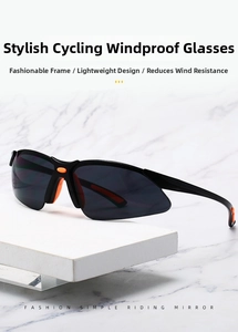 Detail of aerodynamic cycling sunglasses with lightweight black frame and orange accents