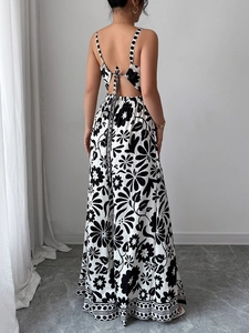 Detail view of the open-back knot design and black-white print on a wide-leg jumpsuit