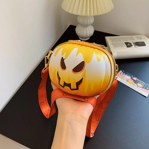 Close-up of Halloween pumpkin crossbody bag with orange strap and black smile face