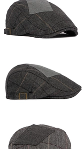 Detail view of grey herringbone flat cap featuring textured wool fabric and metal side buckle
