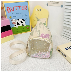 Close-up of kids chest bag featuring transparent PVC pocket with colorful flowing sequins
