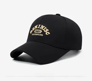 Detail of vintage black baseball cap featuring premium gold 3D embroidery and twill texture