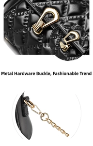 Close-up of golden metal buckle and chain attachment on black quilted handbag