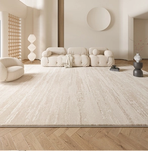 Detalle de la alfombra rectangular beige claro con textura abstracta en el salón