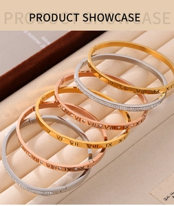 Macro shot of Roman numeral gold plated titanium steel bracelets with diamond details