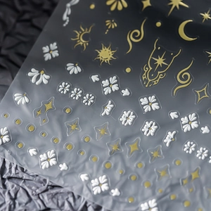 5D embossed gold nail art stickers with 3D celestial sun moon and star patterns