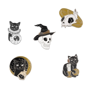 Five-piece dark gothic enamel pin set with black cats and skulls on white backdrop