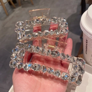 Sparkling crystal shark hair clips in two sizes with luxury rhinestone embellishments