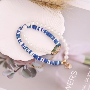 Bohemian double-layer bracelet set with white pearls, blue beads, and gold star charms