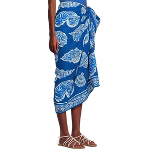 Detail of blue beach sarong with white seashell prints and adjustable waist tie