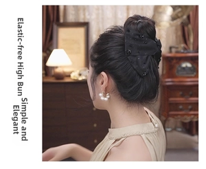 Detail of elegant black double-layer satin bow hair clip styled in a high bun hairstyle