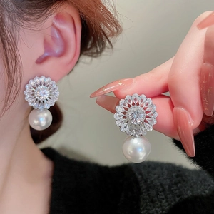 Elegant flower zircon earrings with large hanging pearl drops in polished silver finish