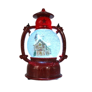 Vintage red lantern snow globe with glowing light, music, and snowy winter house scene