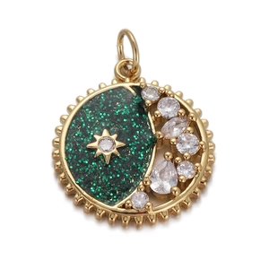 Detail of a gold celestial pendant featuring green glitter enamel with star and moon zircons
