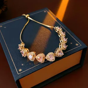 Double-layer heart zircon bracelet in gold with pink stones and adjustable bolo clasp