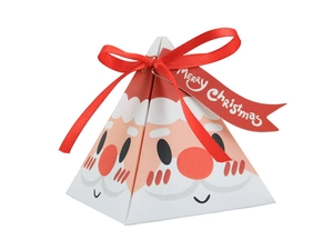 Detail of triangular Santa Claus gift box with red ribbon bow and Merry Christmas tag