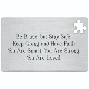 Silver stainless steel motivational wallet card with puzzle cutout and engraved text