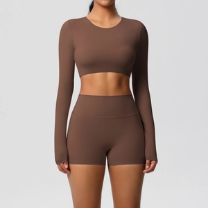 Two-piece chocolate brown yoga set with long sleeve crop top and high waist shorts